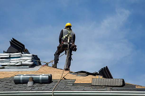 Professional Roof Replacement technician working in Wellsville, OH